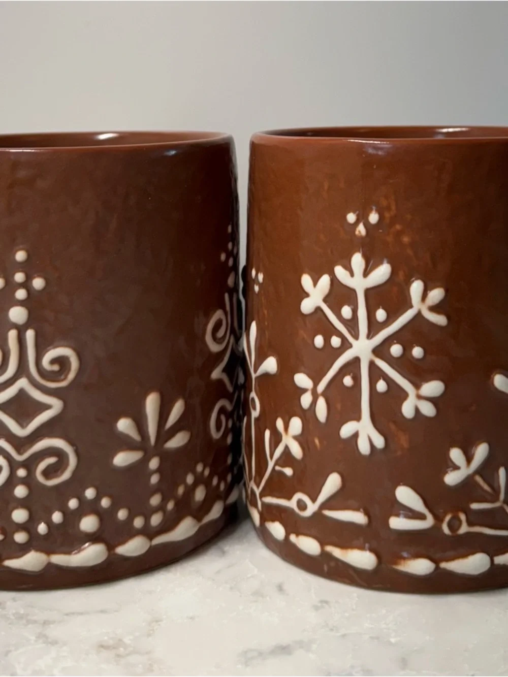 Pottery Barn Brown Ceramic Mug with White Snowflake Design